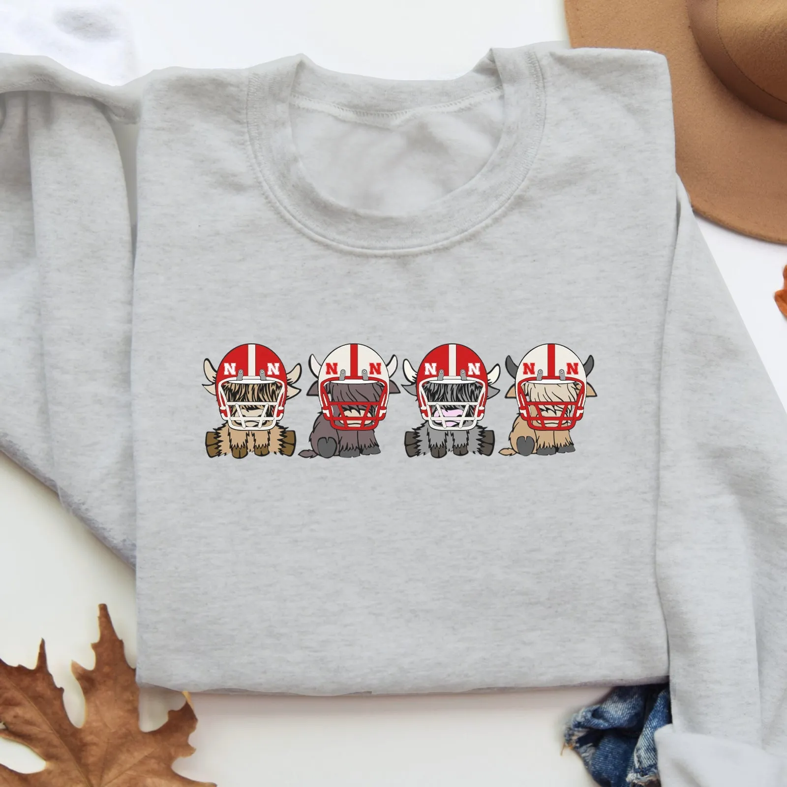 Nebraska Cornhuskers Football Highland Cow Football Team Football Lovers Gift Unisex Crewneck Hoodie Sweatshirt