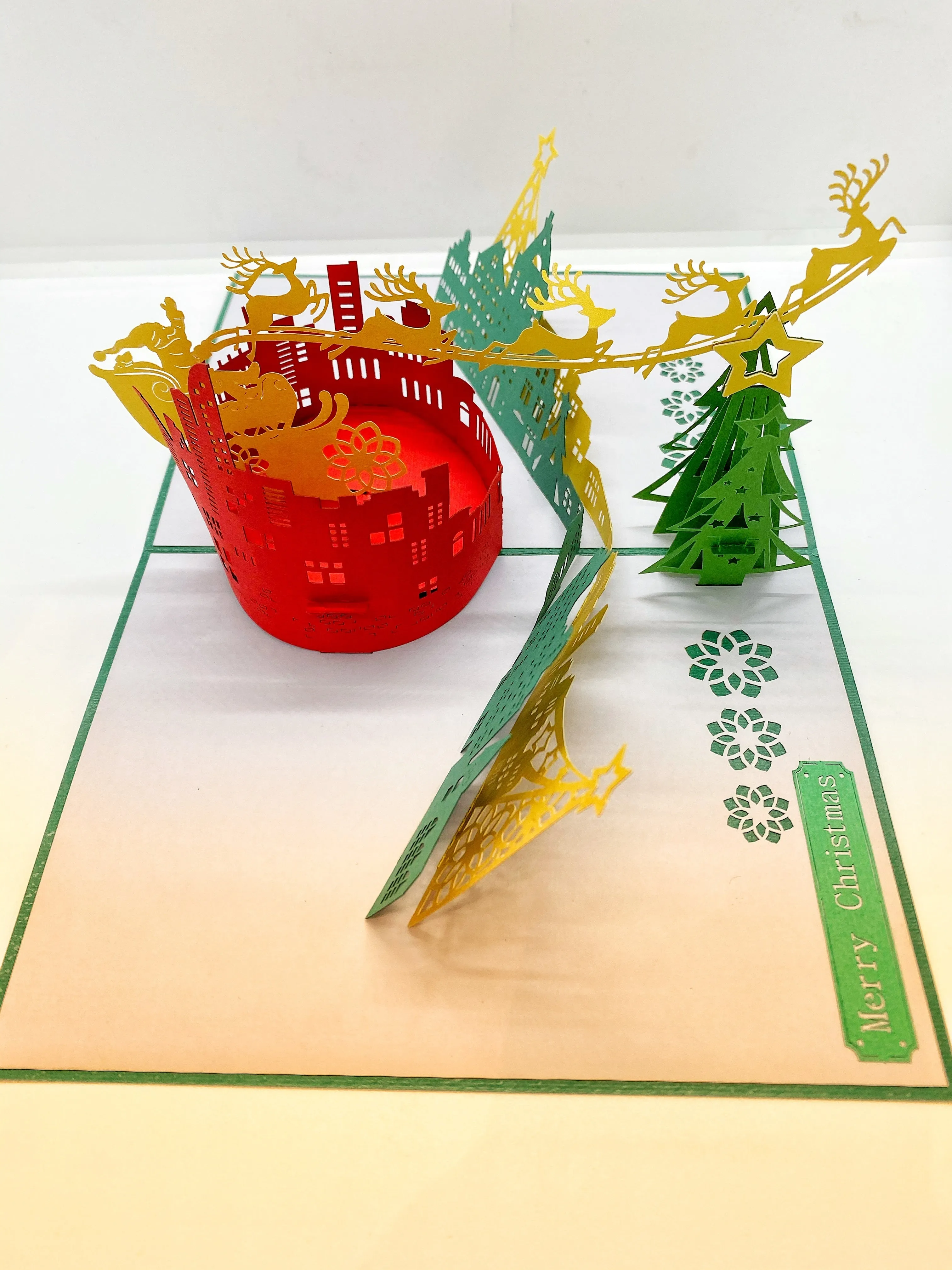 Pop-up Card _ Santa and His Reindeers Flying Over City