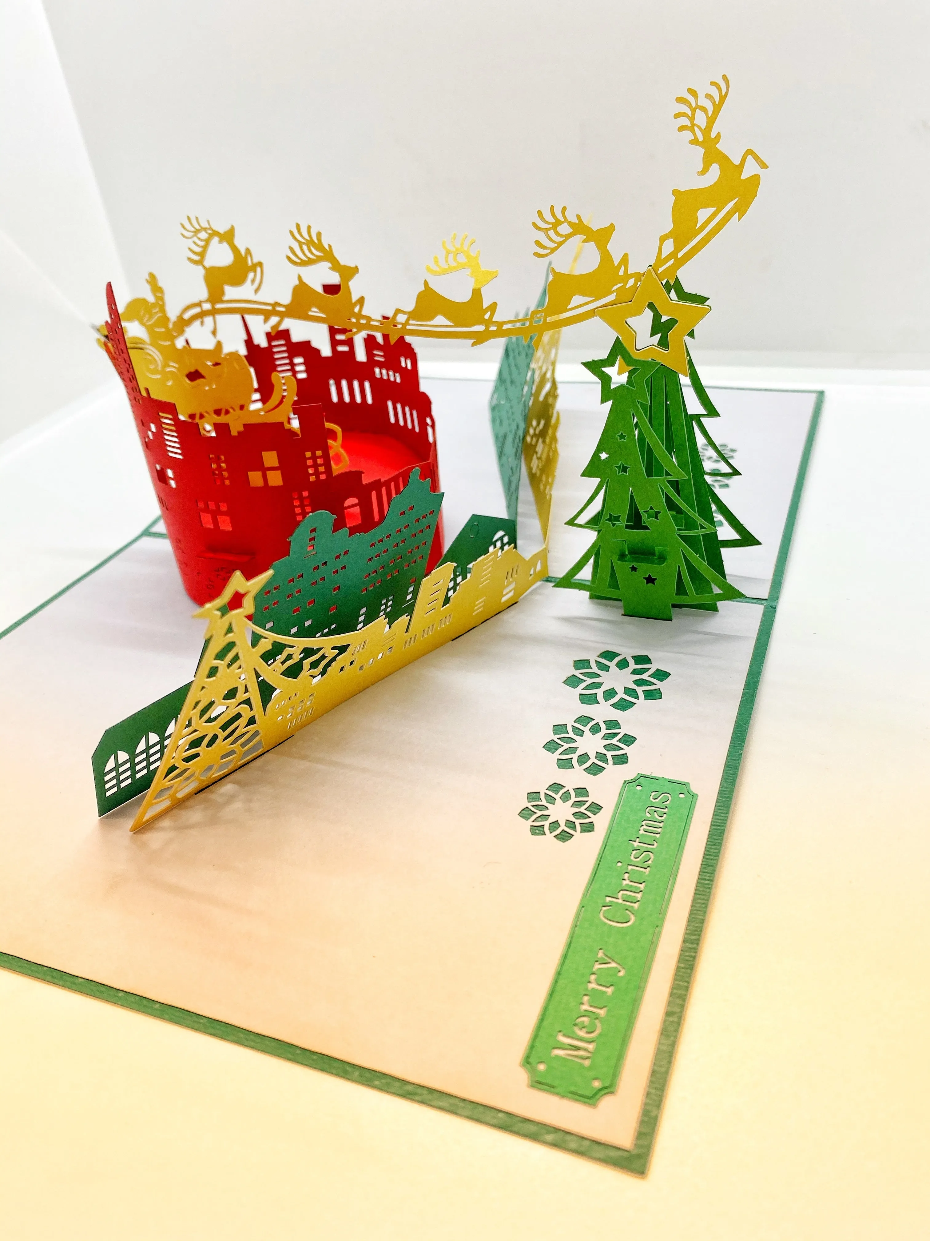 Pop-up Card _ Santa and His Reindeers Flying Over City