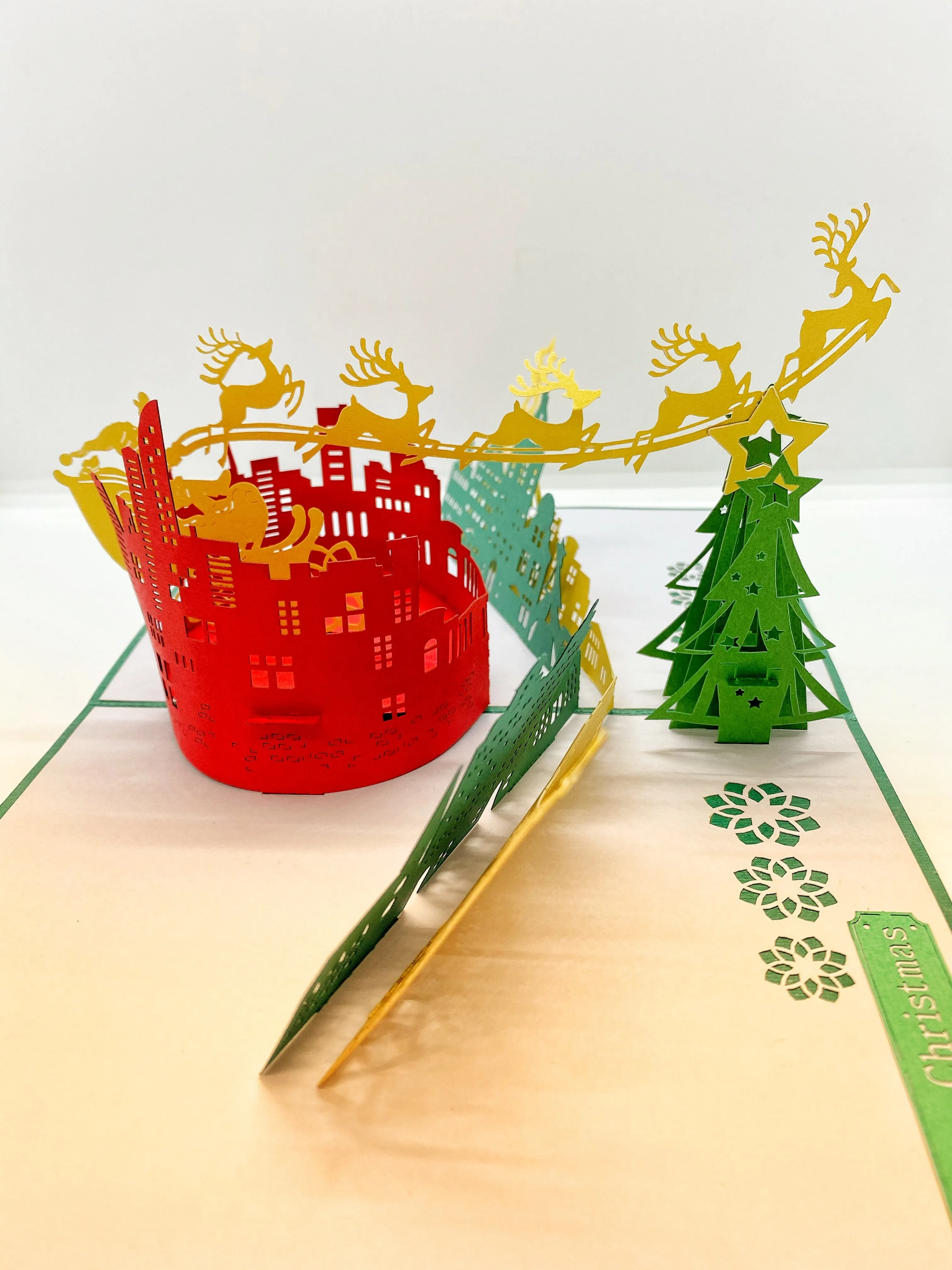 Pop-up Card _ Santa and His Reindeers Flying Over City
