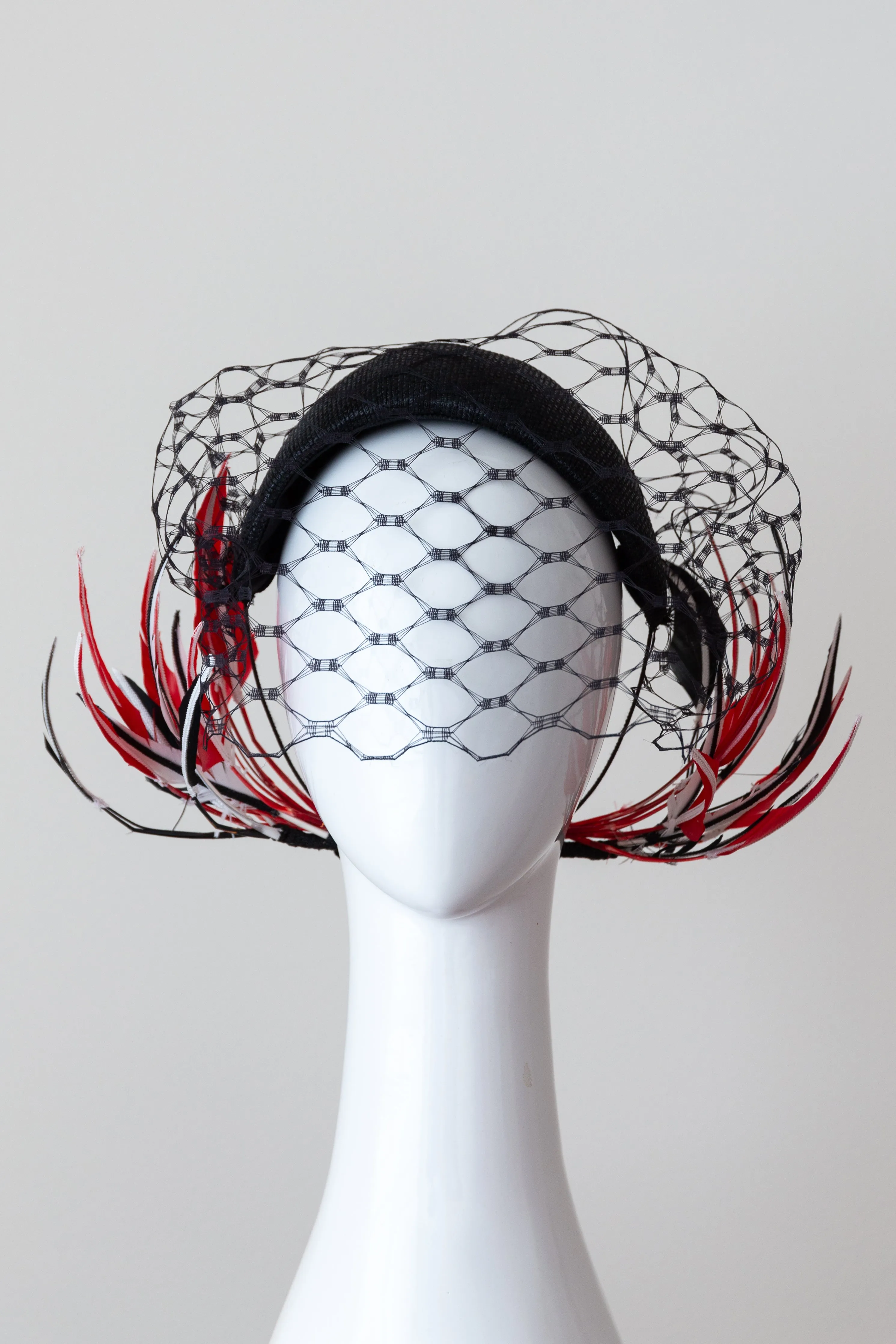 Wide Black Headband with Sweeping Back Feathers