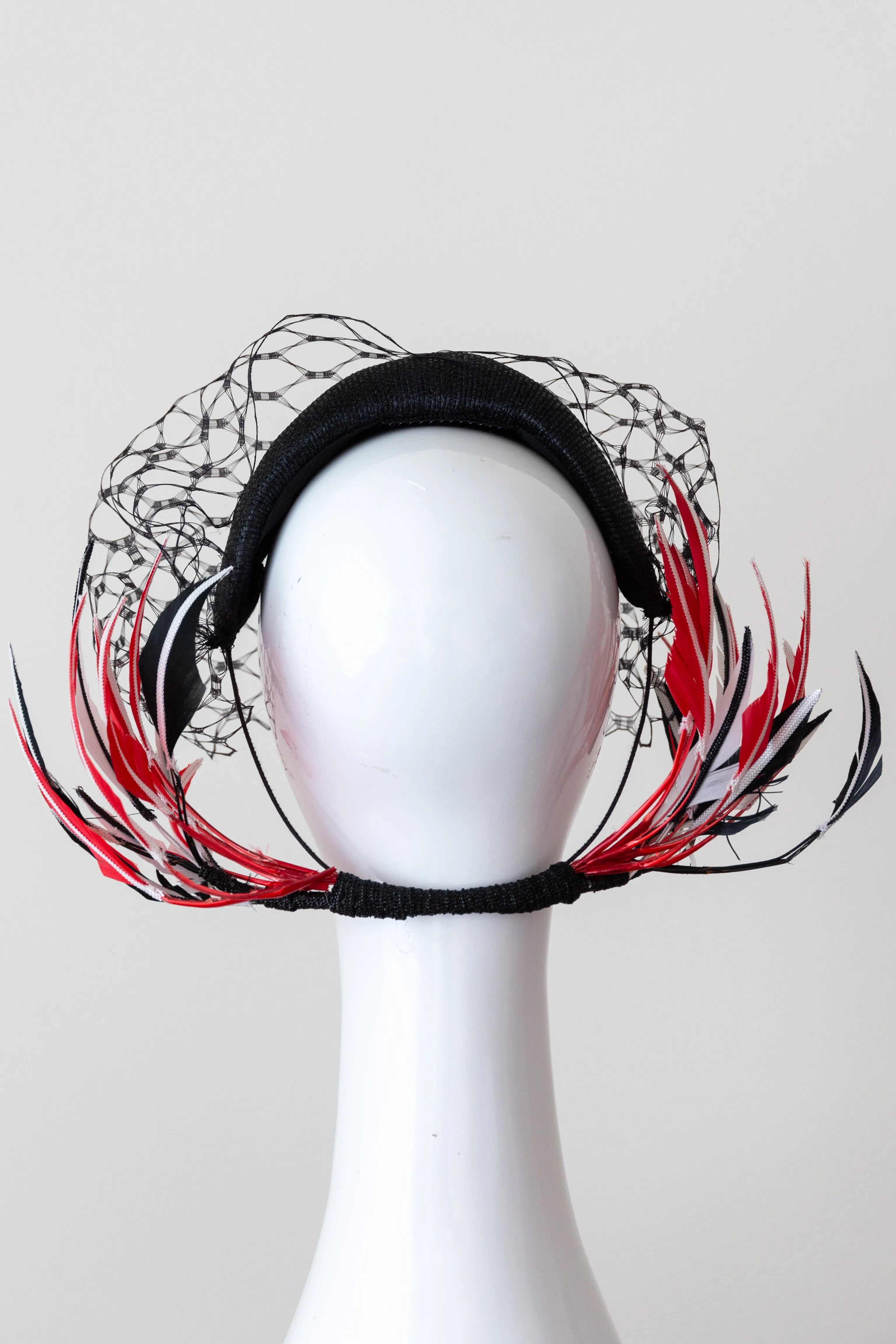Wide Black Headband with Sweeping Back Feathers